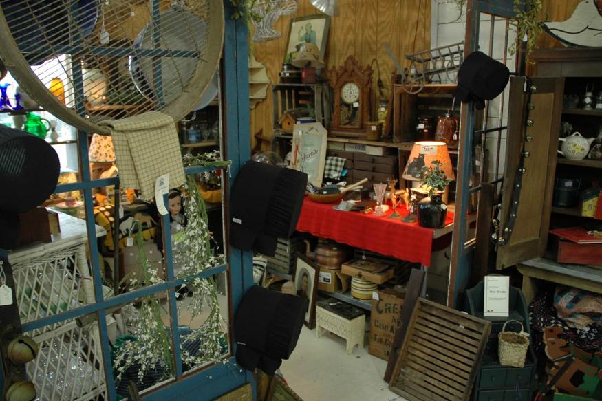 Interior of an antique store with a variety of vintage goods scattered about